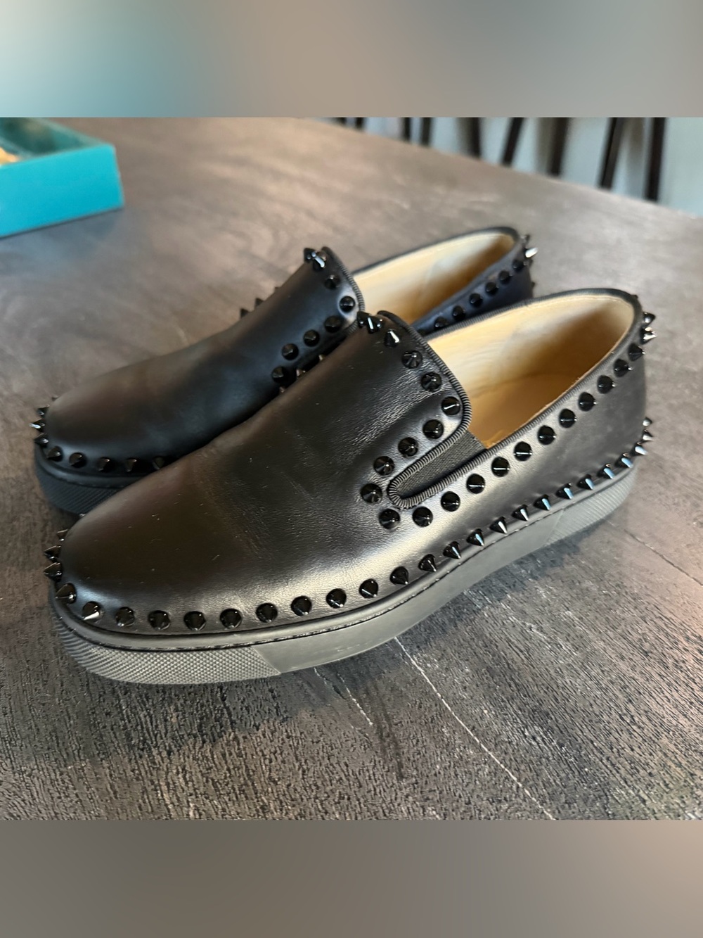 Christian Louboutin Pik Boat slip-on sneakers featuring black studs